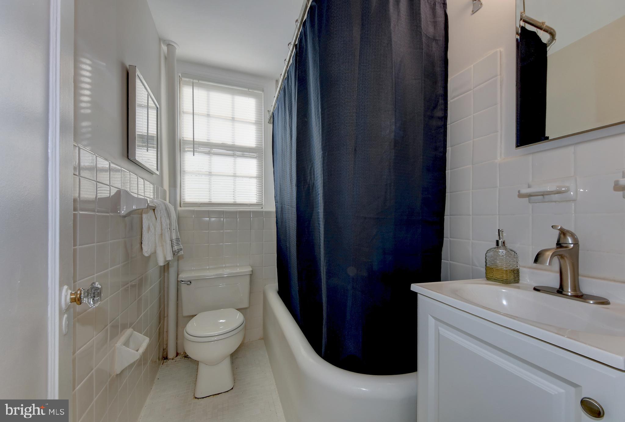 2032 Belmont Road Northwest, Unit 334 Washington, DC 20009 - Photo 12 of 35 Full bathroom with ceramic tile flooring
