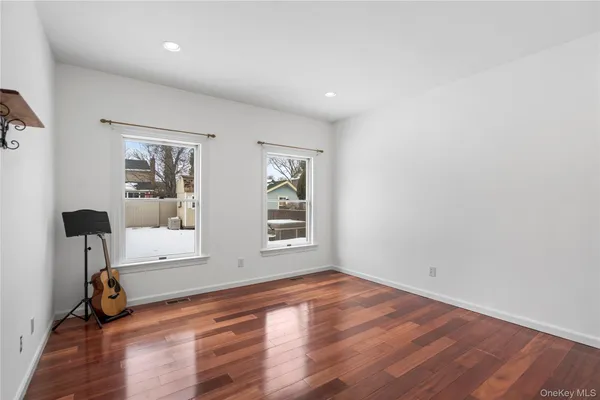 a bedroom with a bed chair and a window