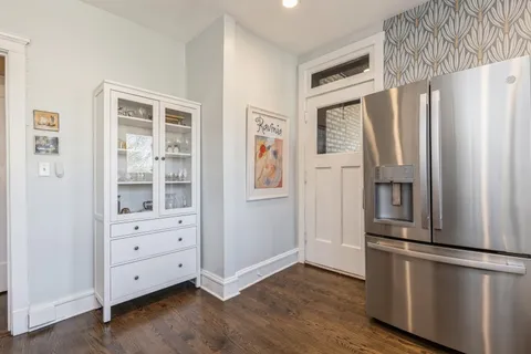 a kitchen with stainless steel appliances a refrigerator and cabinets