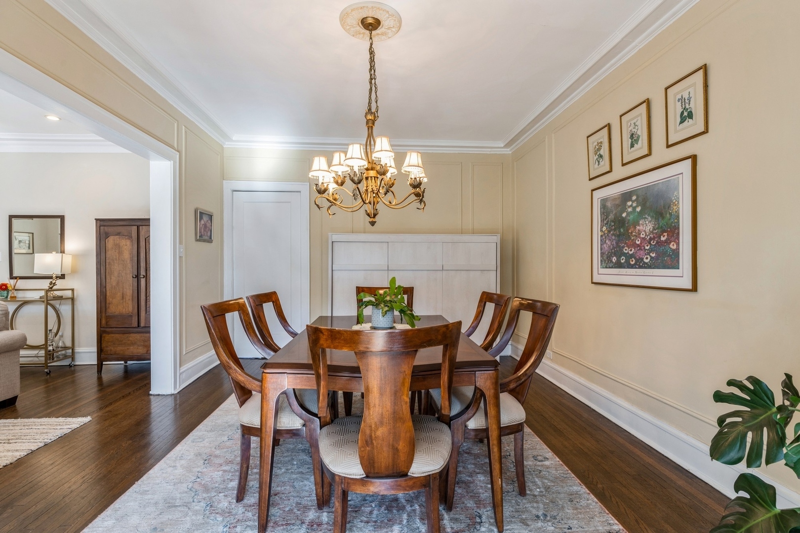 227 Main Street, Unit 3 Evanston, IL 60202 - Photo 6 of 14 a view of a dining room with furniture a chandelier and wooden floor