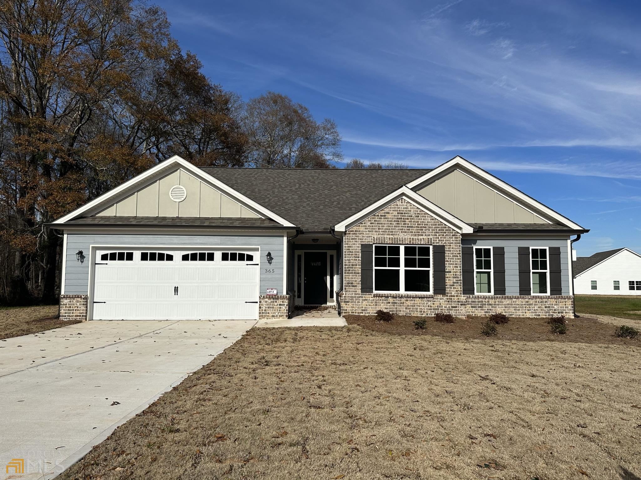 365 Finch Landing Road, Unit 19 Winder, GA 30680 - Photo 1 of 1 a front view of a house with a yard and garage