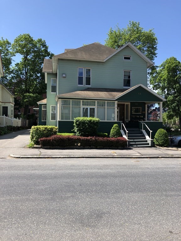 53 William Street, Unit 2 Worcester, MA 01609 - Photo 1 of 1 front view of a house with a small yard