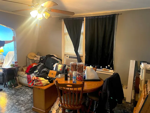 a view of a dining room with furniture and a window