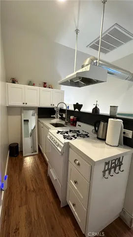 a white refrigerator freezer sitting inside of a kitchen