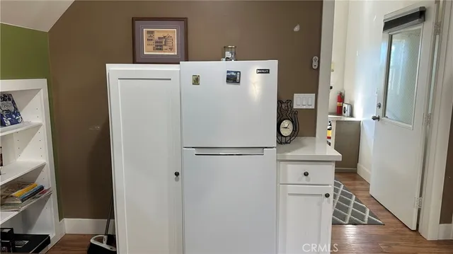 a bedroom with a bed and a table