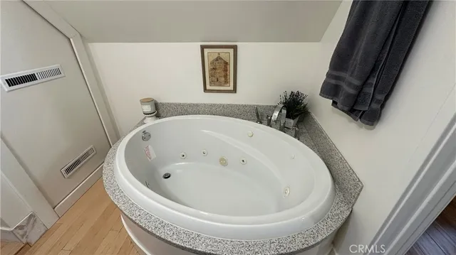 a bathroom with a sink toilet and a mirror