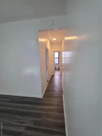 a view of gallery with wooden floor