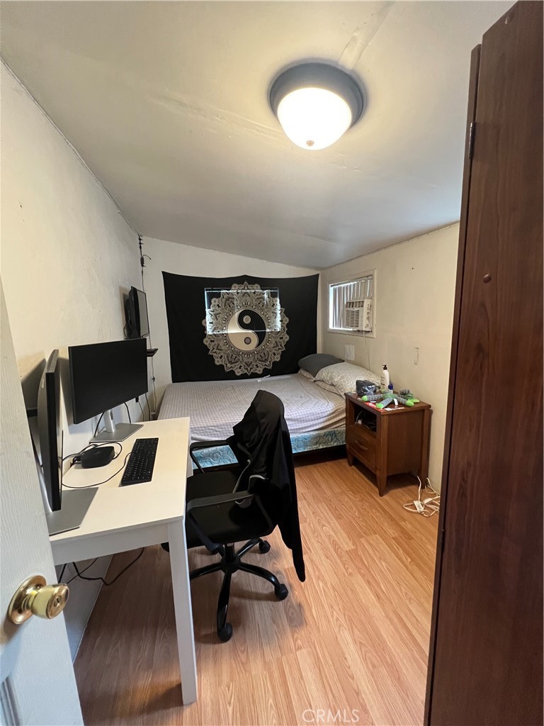 a bedroom with a workspace