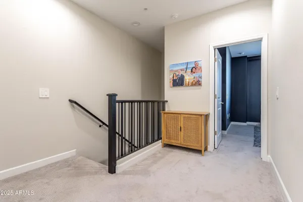 an entryway with stairs and furniture