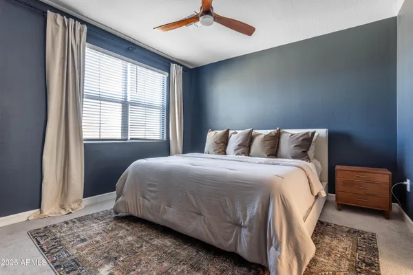 a bedroom with a bed and window