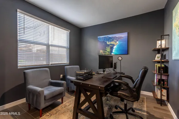 a view of a livingroom with furniture and a window
