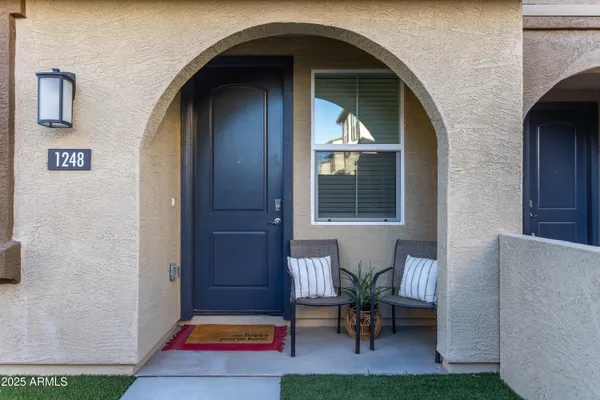 a balcony with furniture and a gate