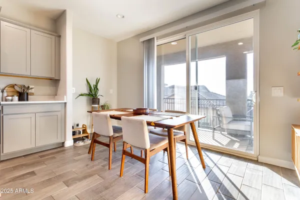 a view of a dining room with furniture window and wooden floor