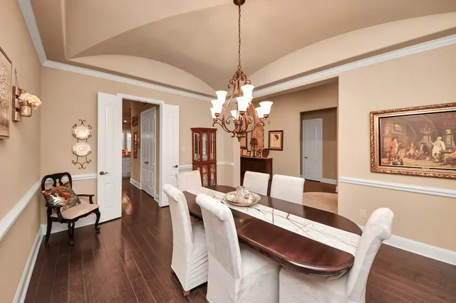 a house view with swimming pool and outdoor seating