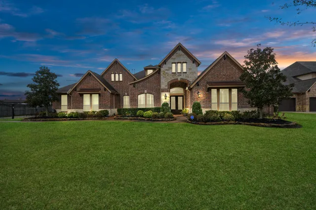 a living room with fireplace furniture and a wooden floor