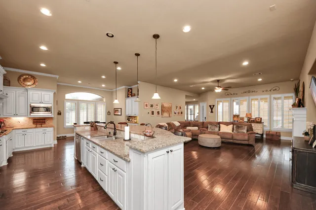 a view of a patio with swimming pool table and chairs