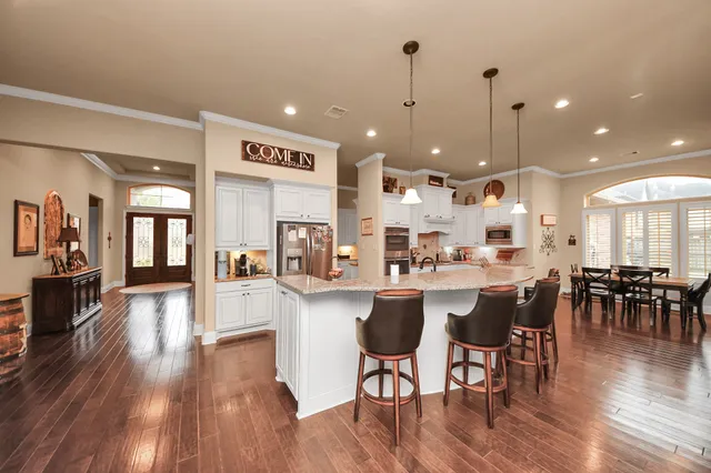 a view of a patio with couches chairs and a table