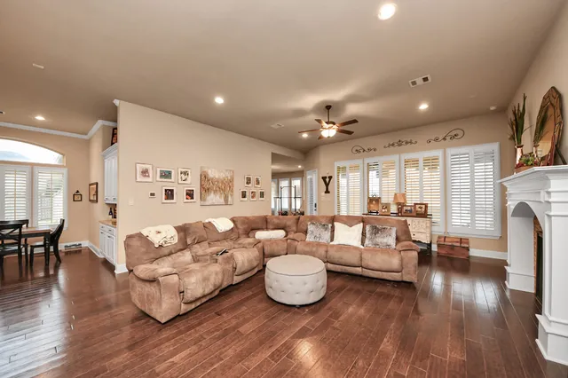 a spacious bathroom with a double vanity sink and a mirror