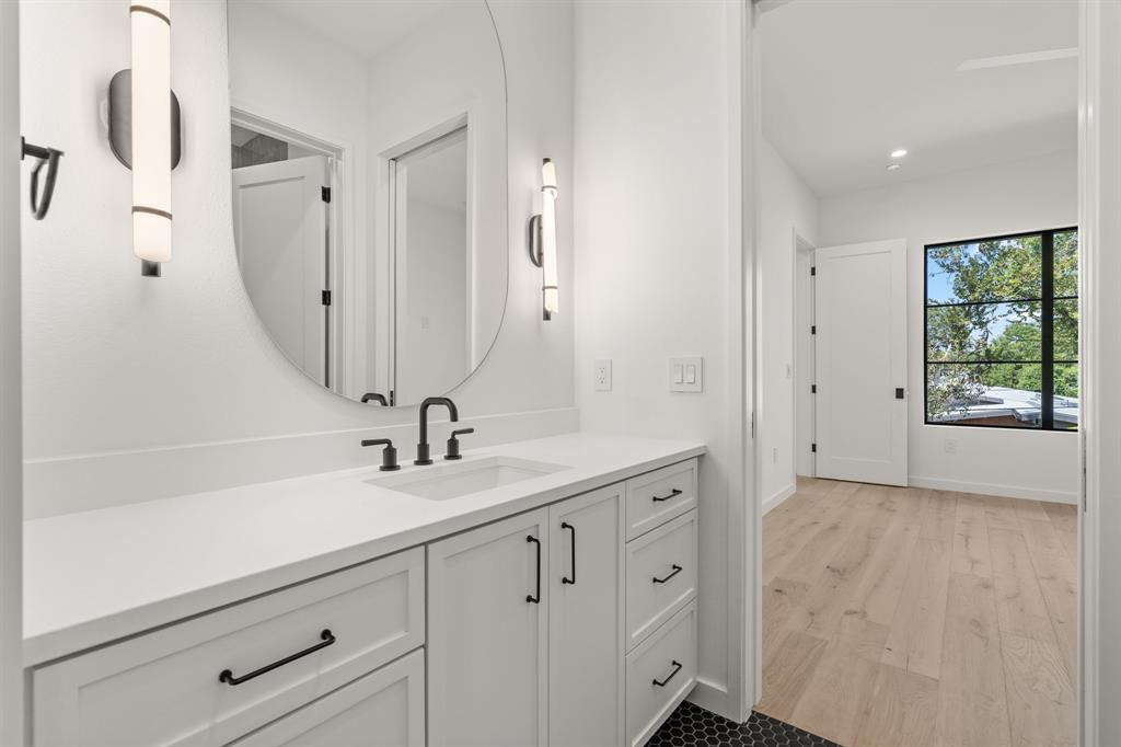 5908 Bull Creek Road Austin, TX 78757 - Photo 26 of 36 This bathroom is attached to bedroom #1 but also has access to the hallway and second floor living area.