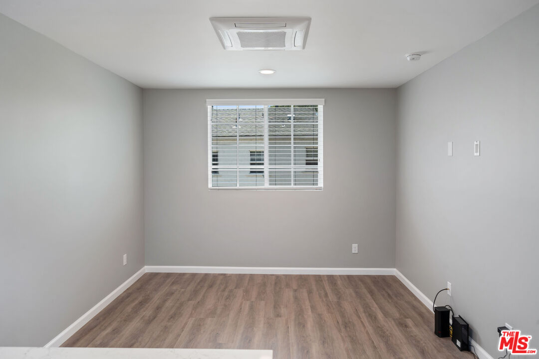 4136 McFarlane Avenue Burbank, CA 91505 - Photo 13 of 24 an empty room with wooden floor and windows