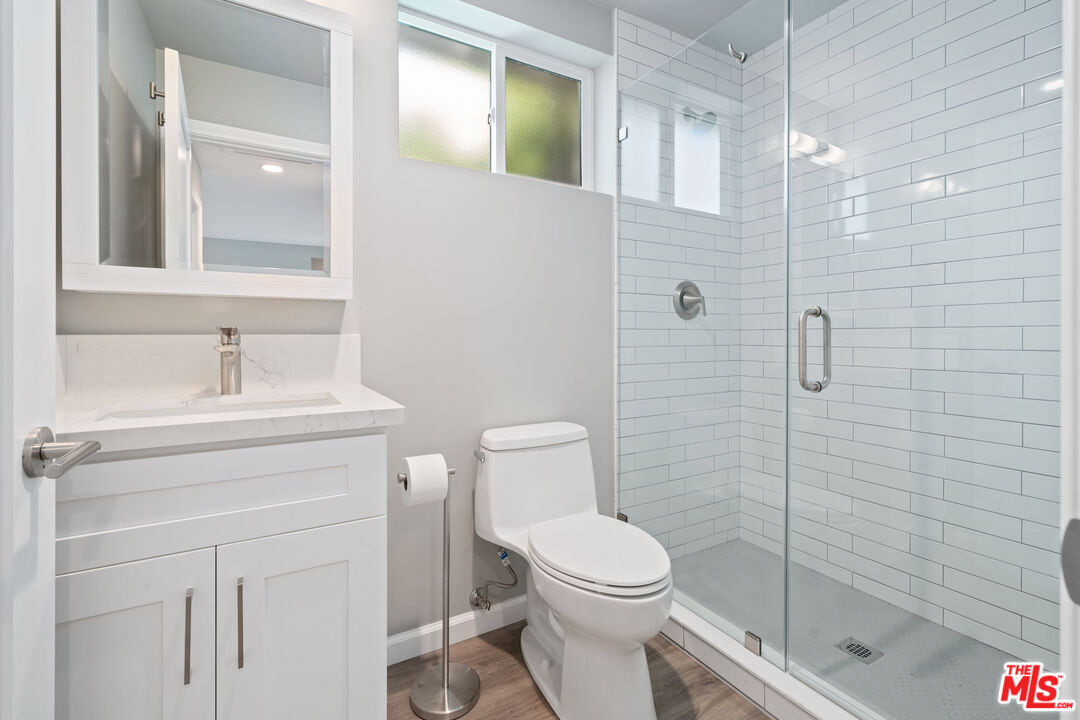 4136 McFarlane Avenue Burbank, CA 91505 - Photo 15 of 24 a bathroom with a sink a toilet and shower