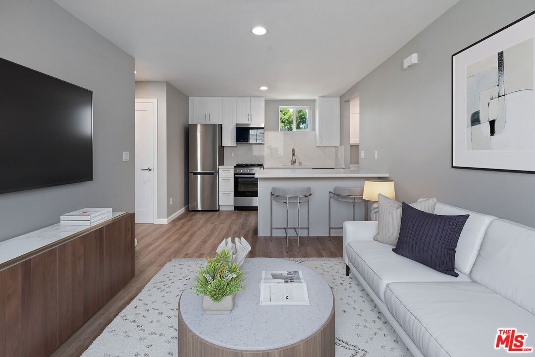 4136 McFarlane Avenue Burbank, CA 91505 - Photo 4 of 24 a living room with furniture and a flat screen tv
