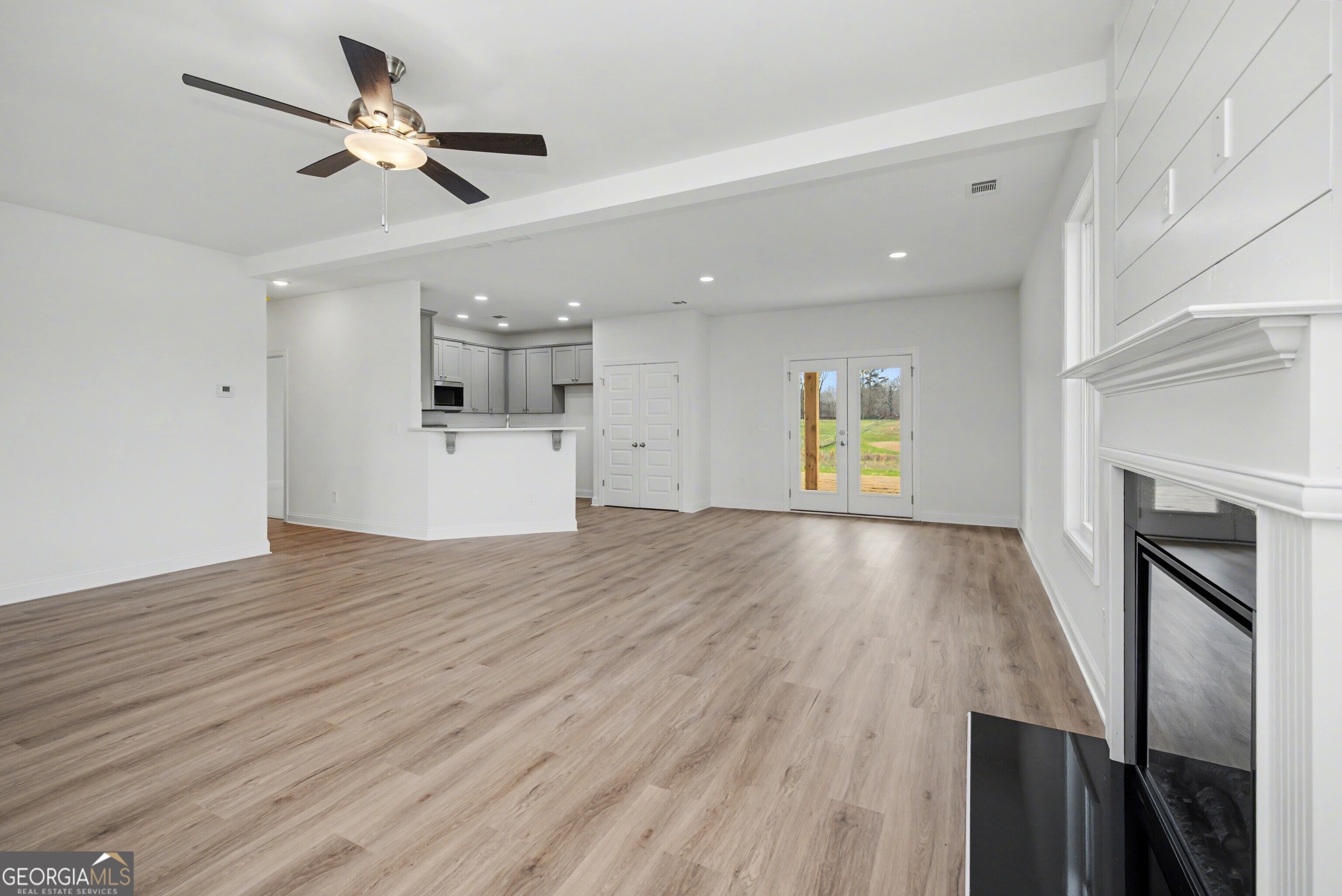 2365 New Hope Road Locust Grove, GA 30248 - Photo 11 of 44 wooden floor in an empty room with a window