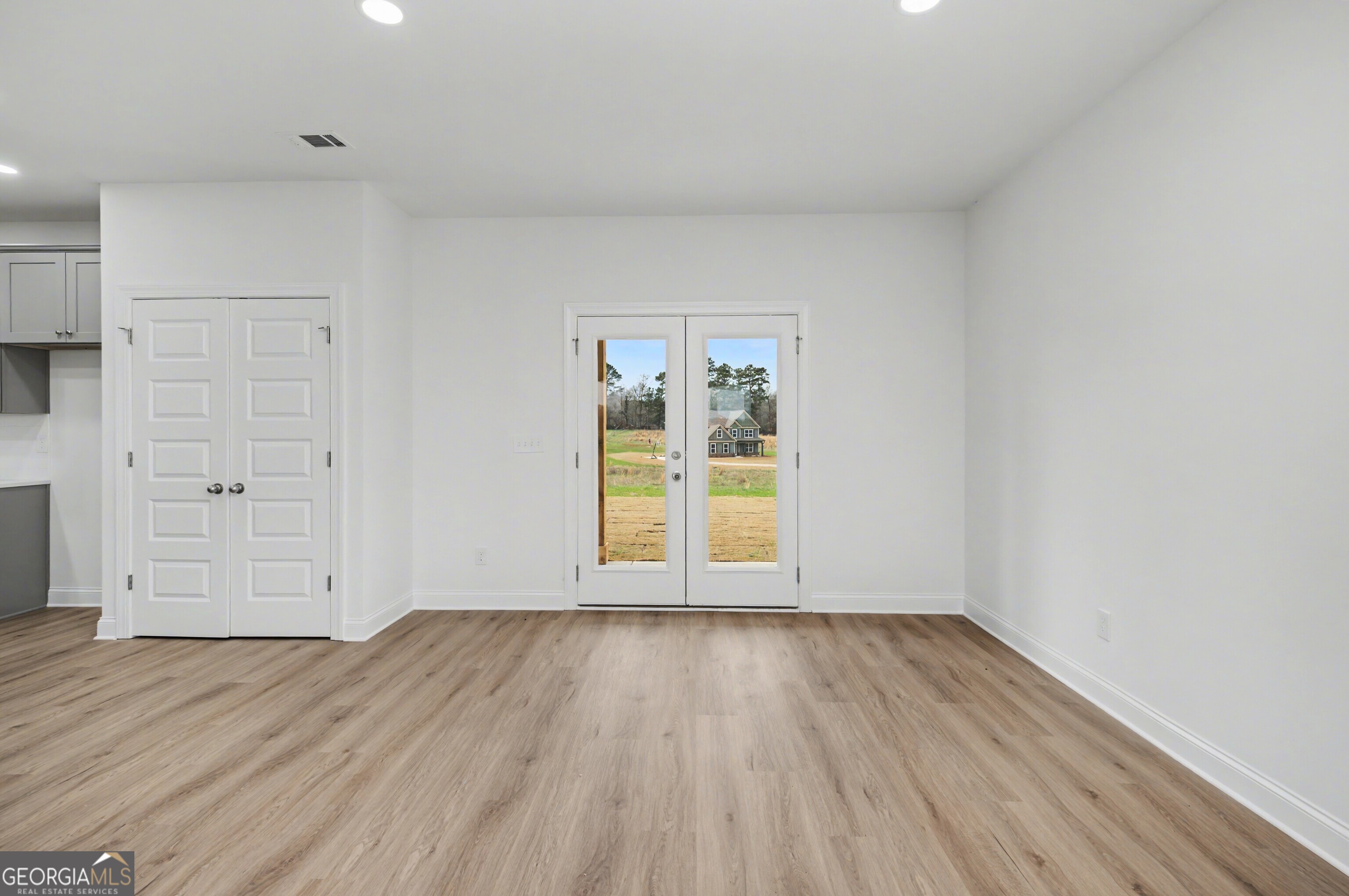 2365 New Hope Road Locust Grove, GA 30248 - Photo 13 of 44 wooden floor in an empty room
