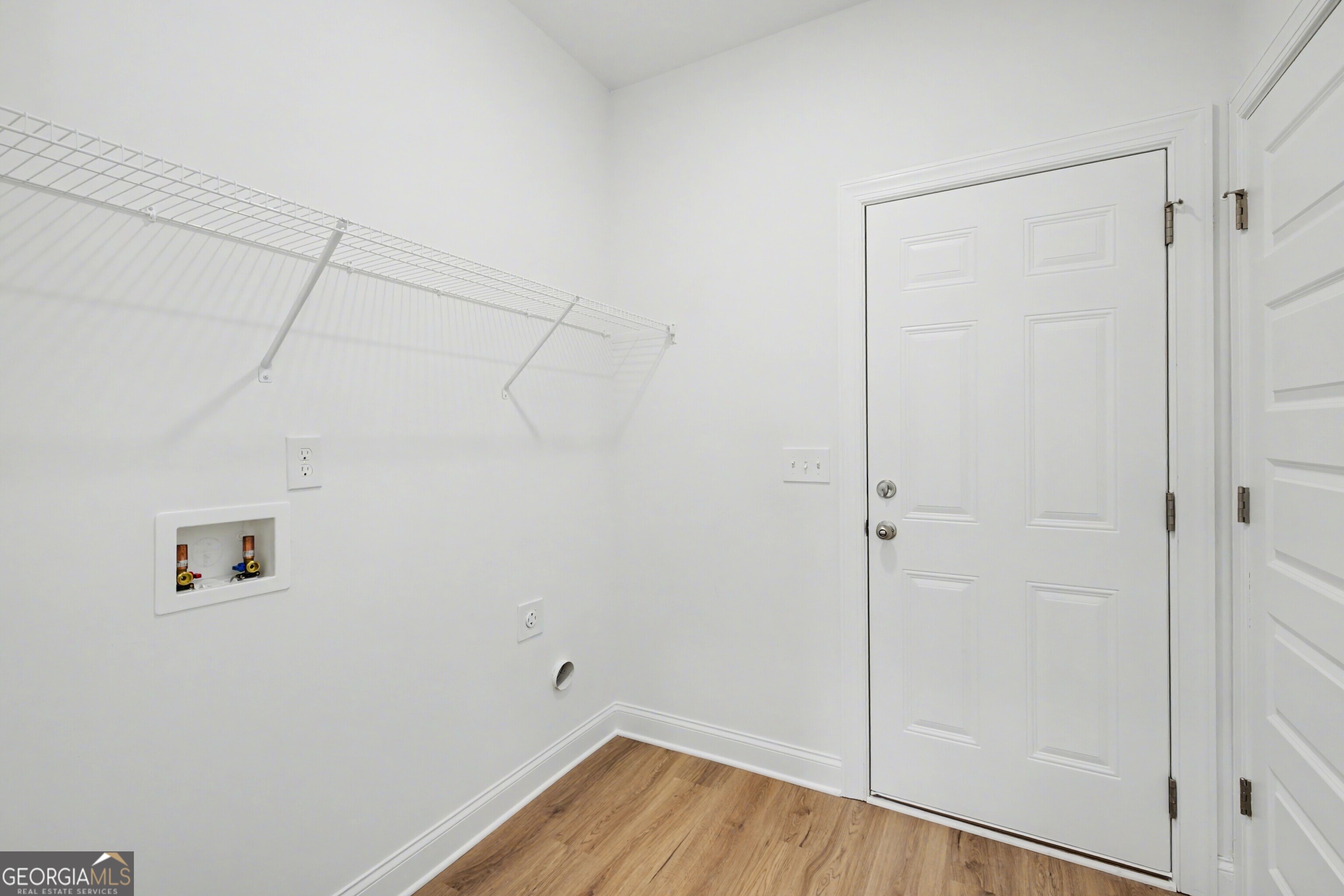 2365 New Hope Road Locust Grove, GA 30248 - Photo 19 of 44 a view of a room with wooden floor