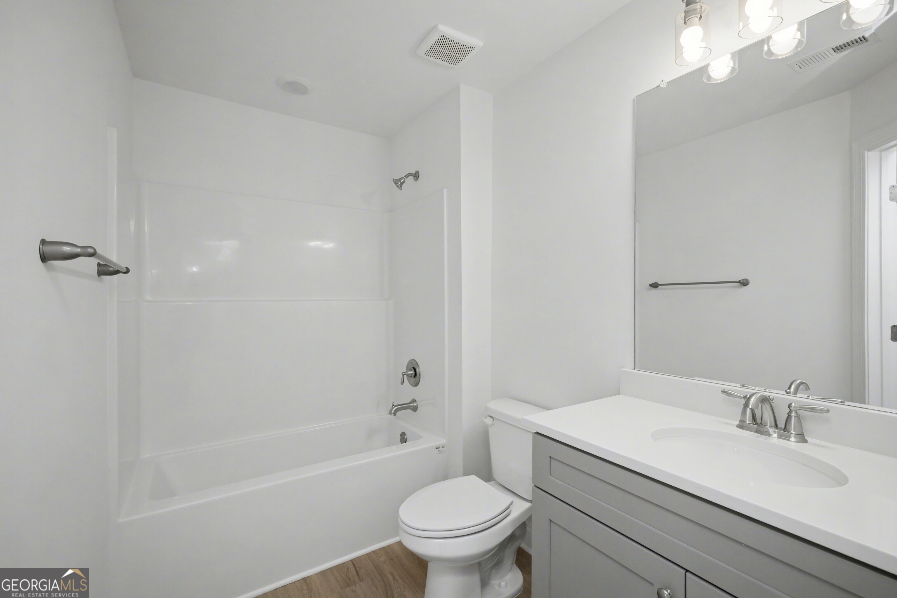 2365 New Hope Road Locust Grove, GA 30248 - Photo 42 of 44 a bathroom with a sink a toilet and a mirror