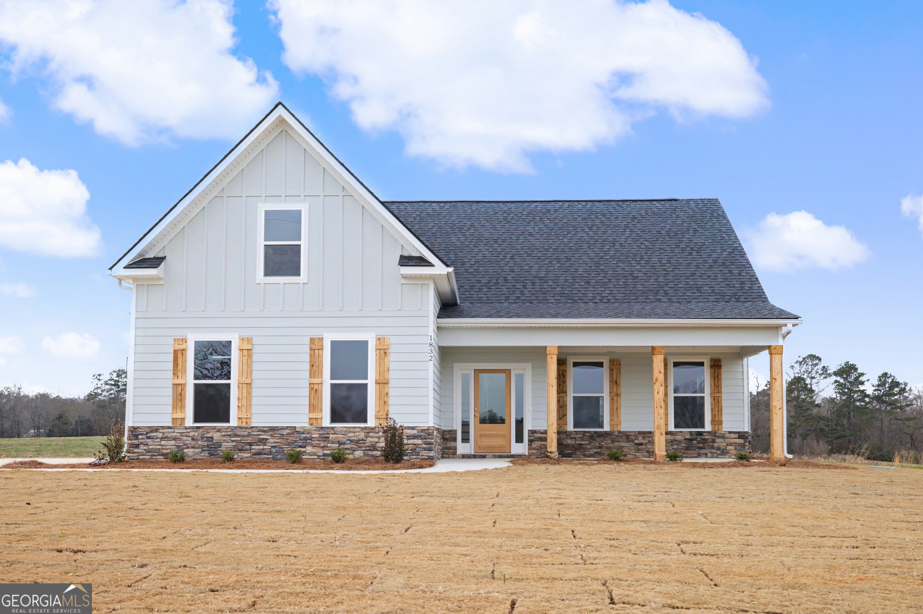 2365 New Hope Road Locust Grove, GA 30248 - Photo 7 of 44 a front view of a house with a yard