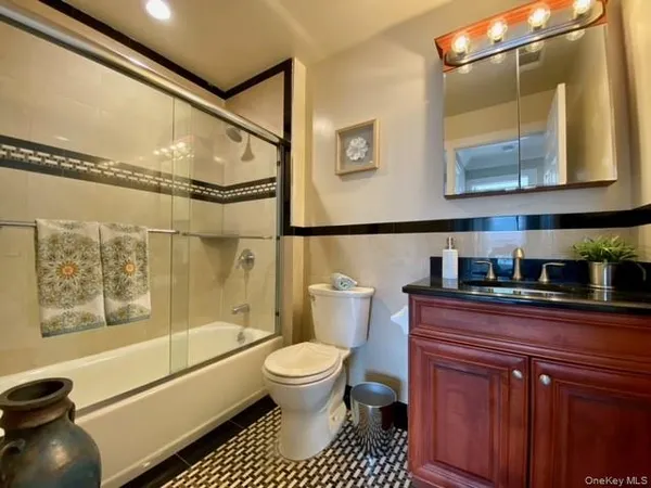 a bathroom with a toilet a sink and a bathtub