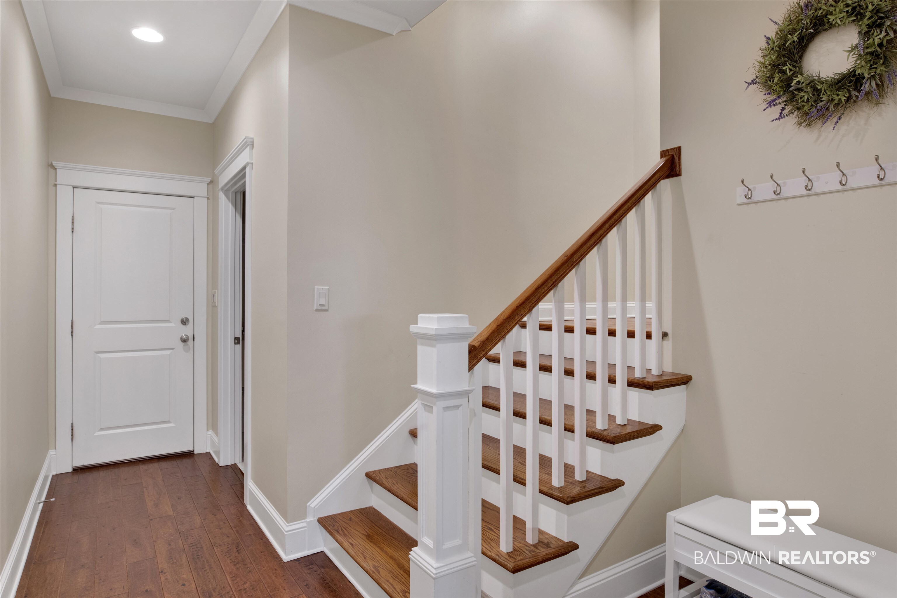131 Sedgefield Avenue Fairhope, AL 36532 - Photo 28 of 50 Stairs with dark hardwood / wood-style floors and ornamental molding