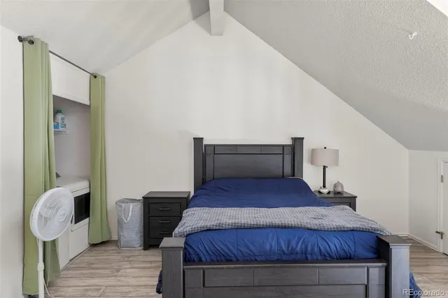 a bedroom with a bed and dresser