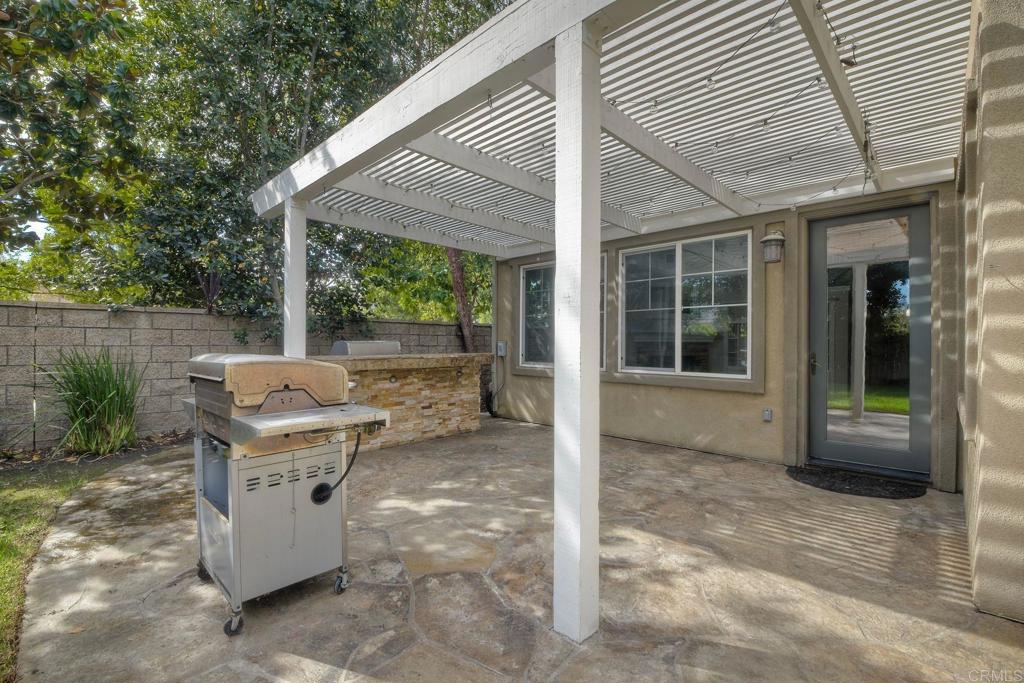 1789 Lemon Tree Court San Marcos, CA 92078 - Photo 25 of 34 a view of a patio with table and chairs and potted plants