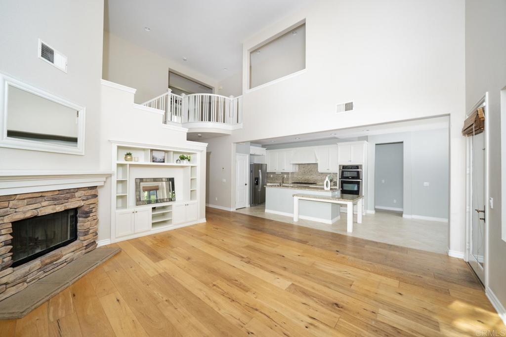 1789 Lemon Tree Court San Marcos, CA 92078 - Photo 34 of 34 a view of kitchen and empty room with wooden floor
