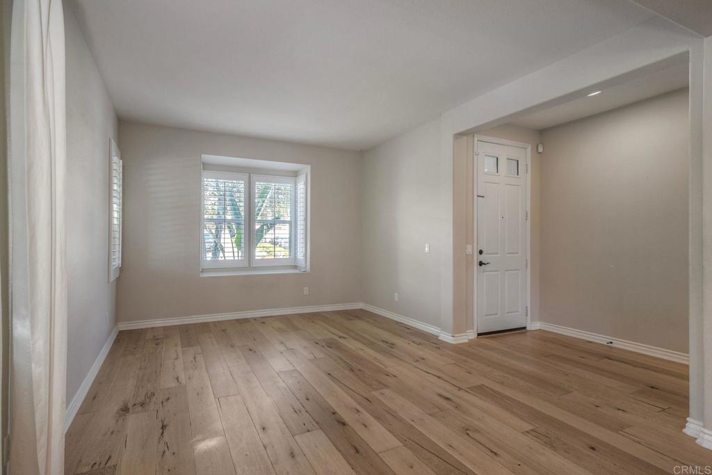 1789 Lemon Tree Court San Marcos, CA 92078 - Photo 4 of 34 a view of an empty room with wooden floor and a window