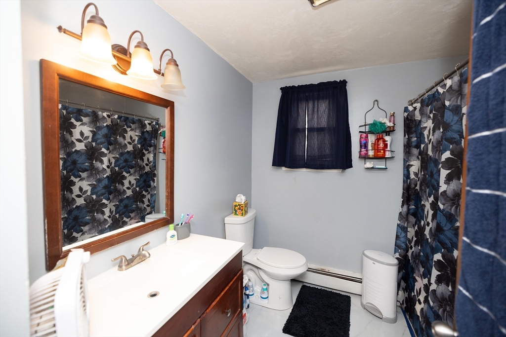 700 Franklin Street Worcester, MA 01604 - Photo 12 of 24 a bathroom with a toilet sink and mirror