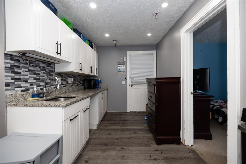 700 Franklin Street Worcester, MA 01604 - Photo 16 of 24 a kitchen with stainless steel appliances granite countertop a refrigerator and a stove