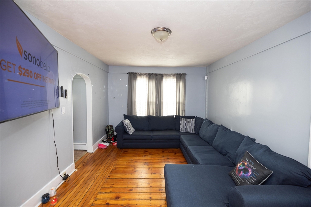 700 Franklin Street Worcester, MA 01604 - Photo 4 of 24 a living room with furniture and a window