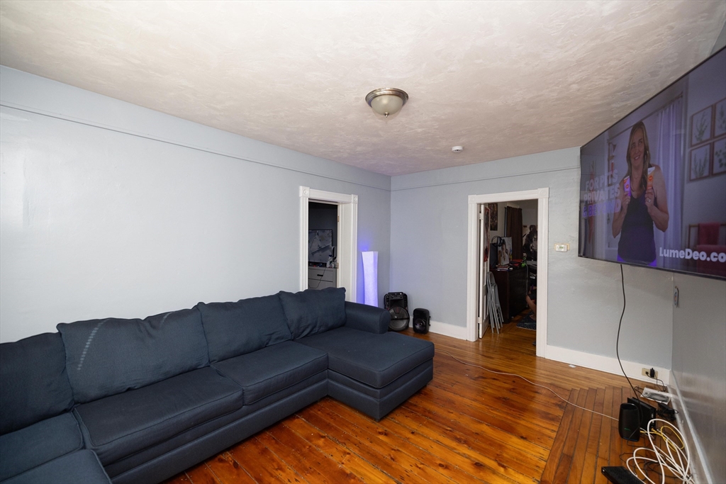 700 Franklin Street Worcester, MA 01604 - Photo 5 of 24 a living room with furniture and a air conditioner vent