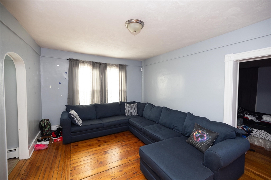 700 Franklin Street Worcester, MA 01604 - Photo 6 of 24 a living room with furniture and a flat screen tv