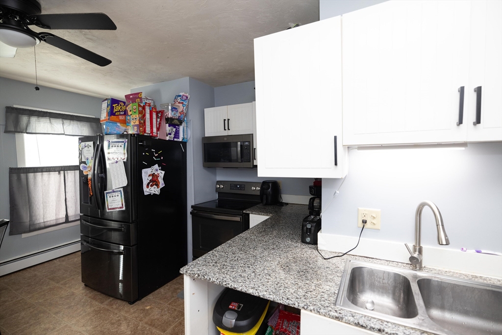 700 Franklin Street Worcester, MA 01604 - Photo 7 of 24 a kitchen with a refrigerator and a sink
