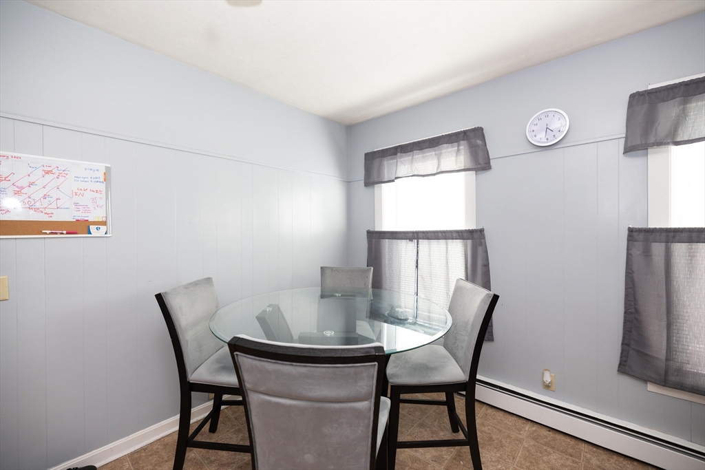700 Franklin Street Worcester, MA 01604 - Photo 9 of 24 a view of a dining room with furniture and a window