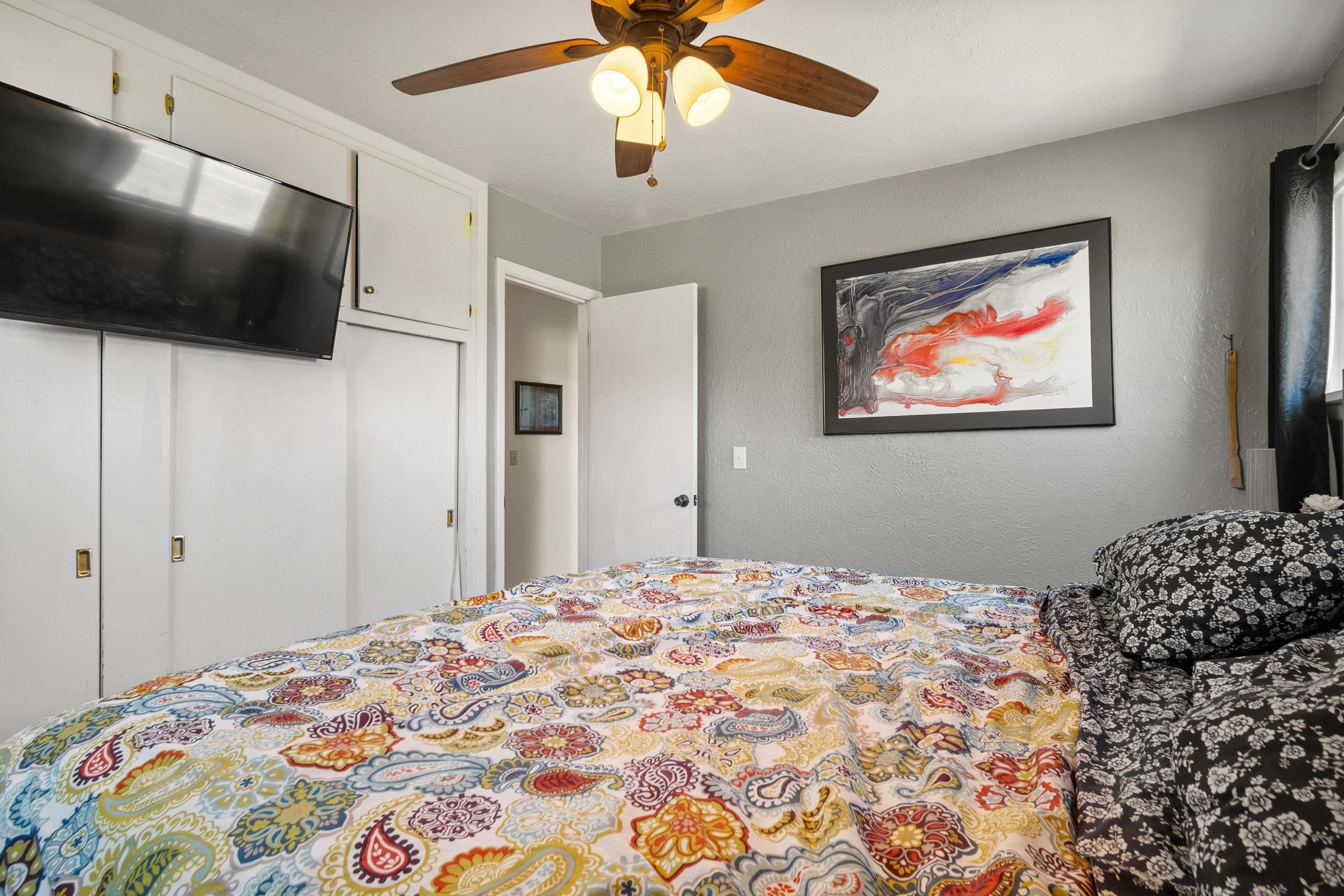 665-30 30 1/2 Road Grand Junction, CO 81504 - Photo 17 of 38 a bedroom with bed and a flat screen tv