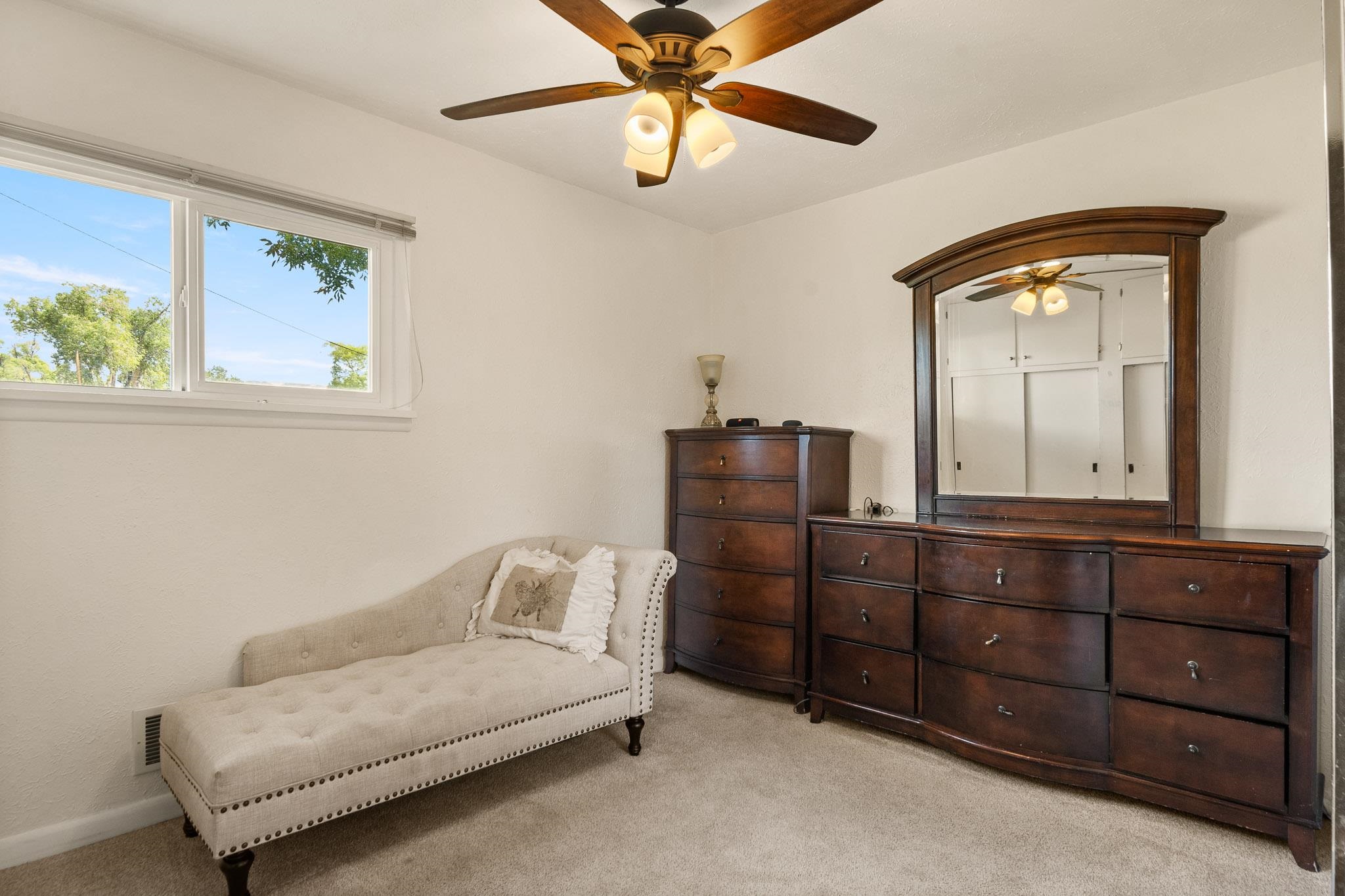 665-30 30 1/2 Road Grand Junction, CO 81504 - Photo 21 of 38 a bedroom with a bed and cabinet with mirror