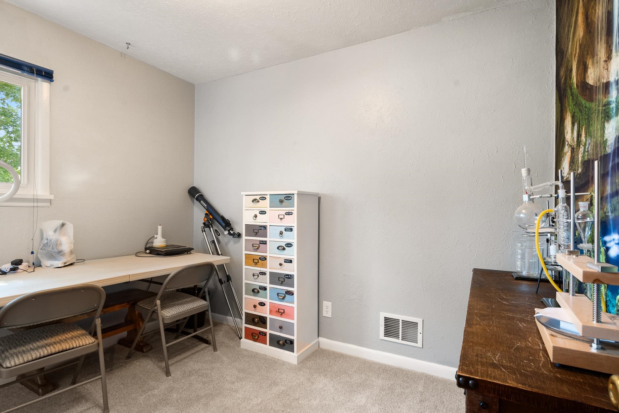 665-30 30 1/2 Road Grand Junction, CO 81504 - Photo 23 of 38 a bedroom with a bed and a desk in it