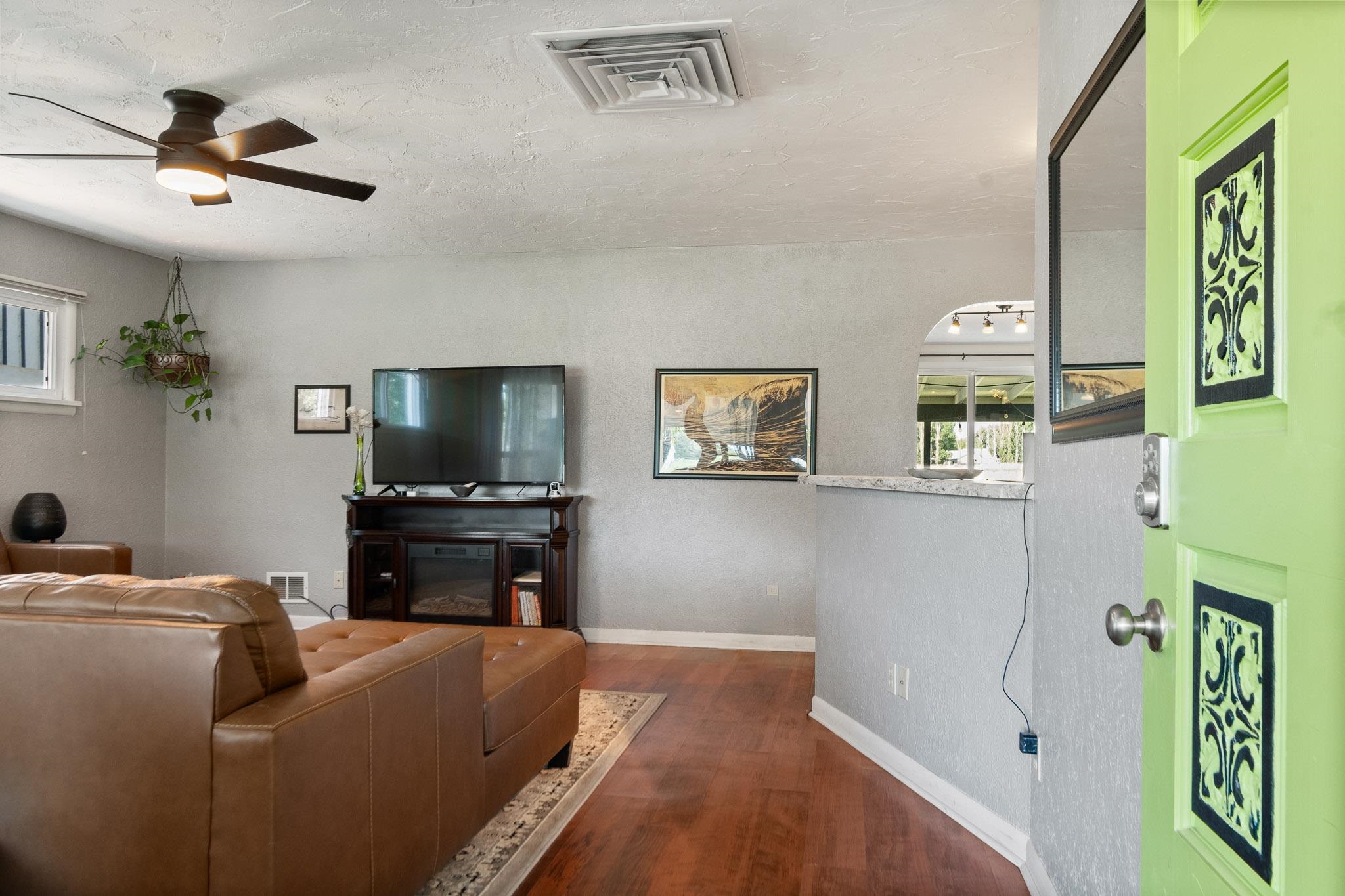 665-30 30 1/2 Road Grand Junction, CO 81504 - Photo 8 of 38 a living room with furniture and a flat screen tv