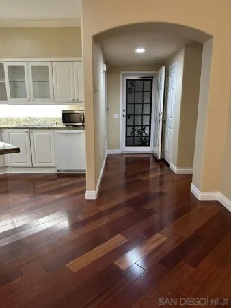 a view of a livingroom with furniture window and wooden floor