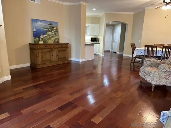a kitchen with granite countertop a sink stove and refrigerator